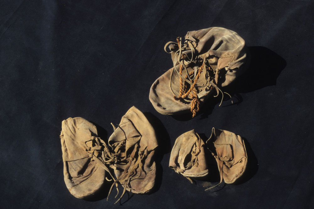 The unwrapped shoe bundle showing the two pairs of children's shoes and the adult isolate. (Photo credit: © 2005 Franco M. Giani Milano-Italy)
