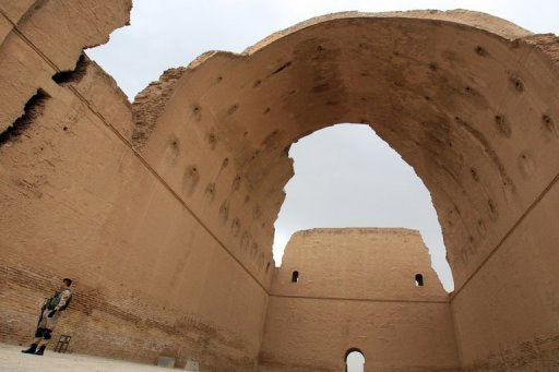 An Iraqi soldier stands under the ancient Arch of Ctesiphon near Baghdad on May 15, 2013. 