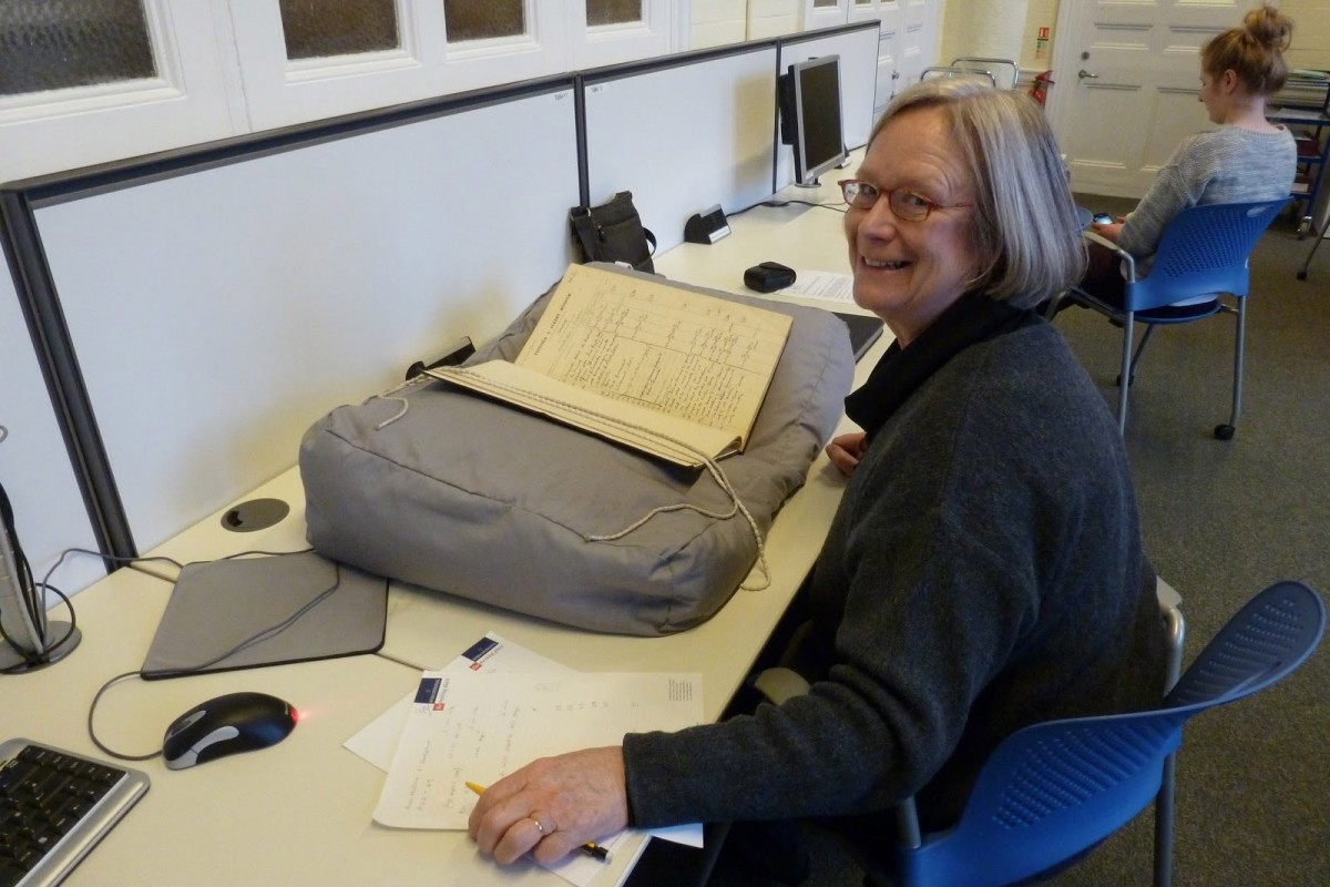 Researcher Rosalind Haddon checking archival material at the Victoria &Albert Museum.