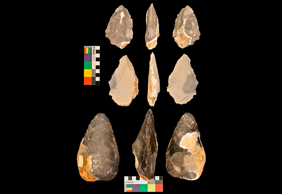 Three hand axes produced by participants in the experiment. Front, back and side views are shown. Photo: University of Liverpool.