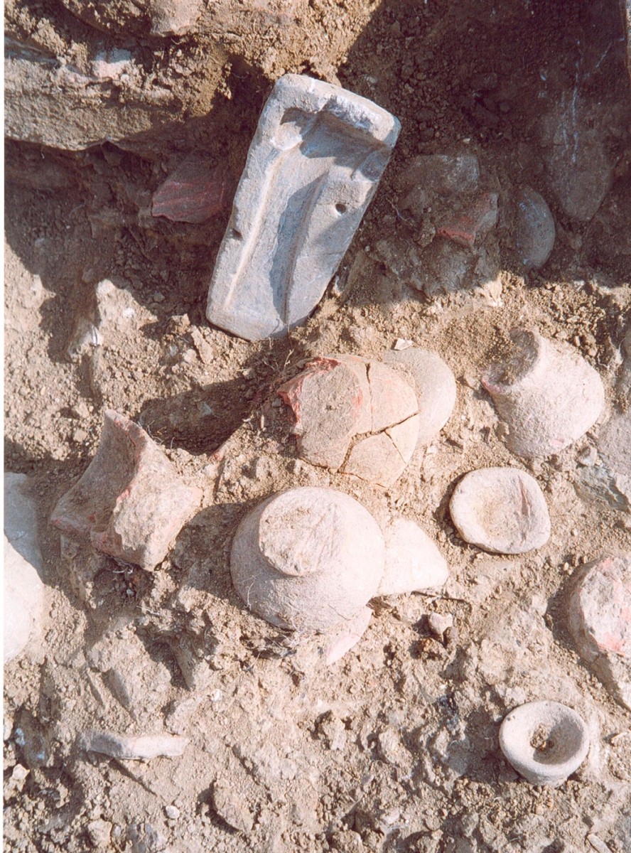 Fig. 45. Minoan type handless conical cups and stone mould for the manufacture of one-edged axes from the “Minoanising” sector.