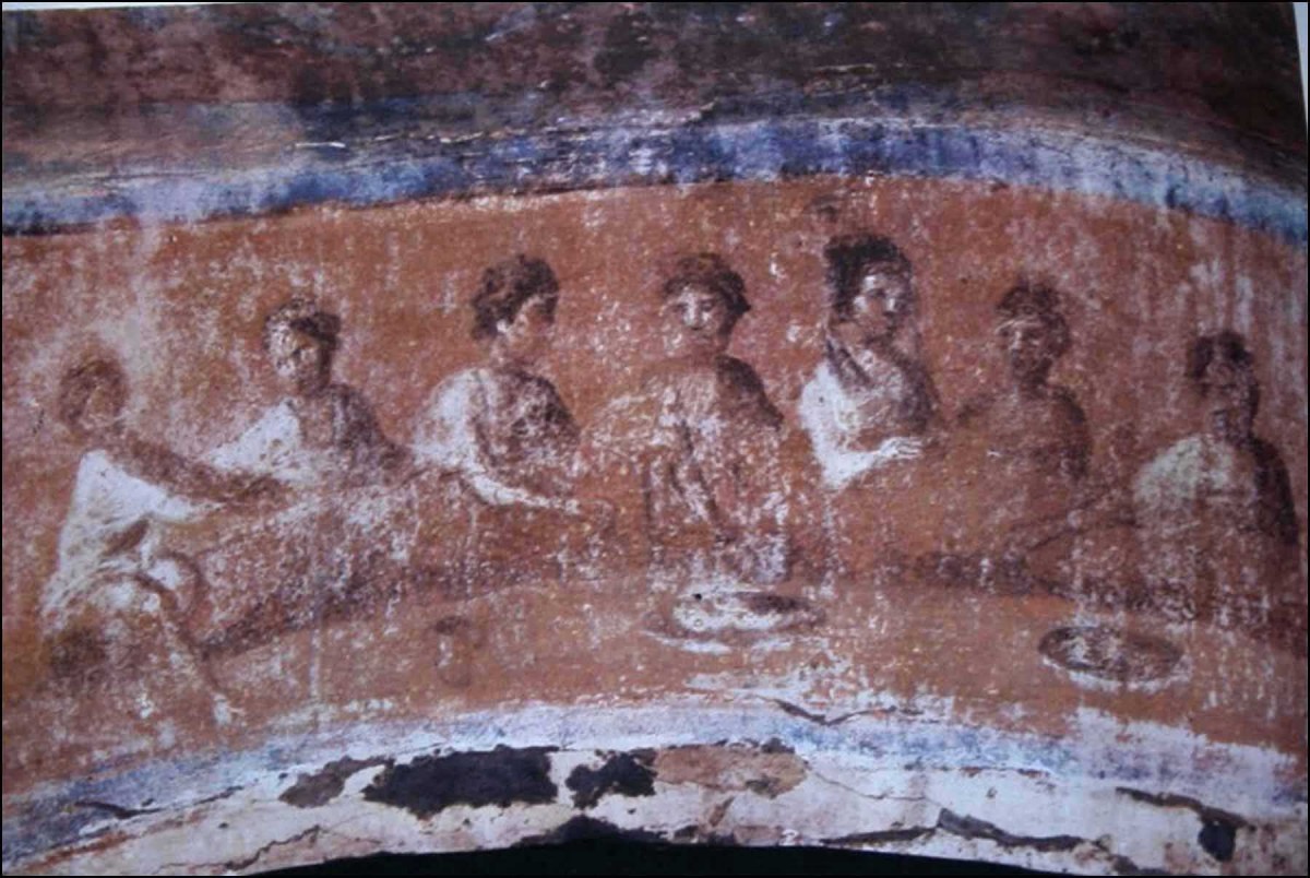The fresco in the central arch at the back of the Greek Chapel shows a banquet. 