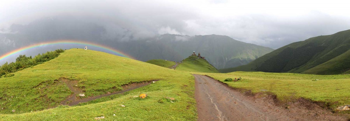 A panorama taken in front of Tsiminda Sameba (the Holy Trinity Church) in Kazbegi, Georgia.