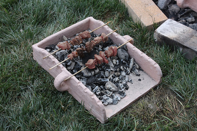 Replica of a Mycenaen barbecue tray as used during J. Hruby's culinary experiment.Credit: Julie Hruby.