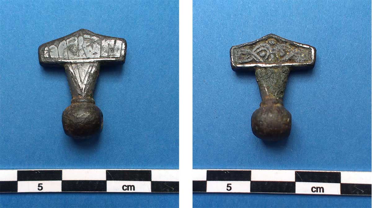 Both sides of the Thor’s Hammer Amulet (runes on left hand). Image: National Museum of Denmark