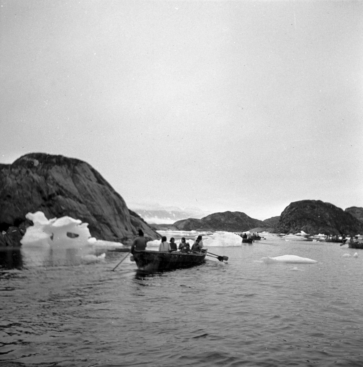 Greenlandic Inuit from the 1930s pictured in their traditional boats (umiaq), used for hunting and transportation. Credit: Jette Bang Photos/Arktisk Institut. Copyright: Arktisk Institut.