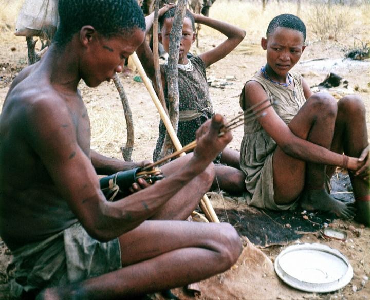 !Kung Kalahari Bushmen in Africa sit in camp. Credit: Polly Wiessner, University of Utah