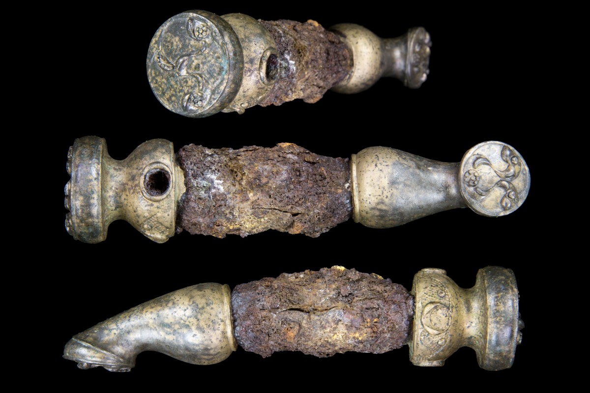 Fig. 1. Chariot linch pin from three angles, showing the intricate decoration at the ends. Credit: University of Leicester. 