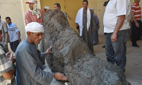 A huge red-granite armless colossus of a seated person, El-Damaty, was found.