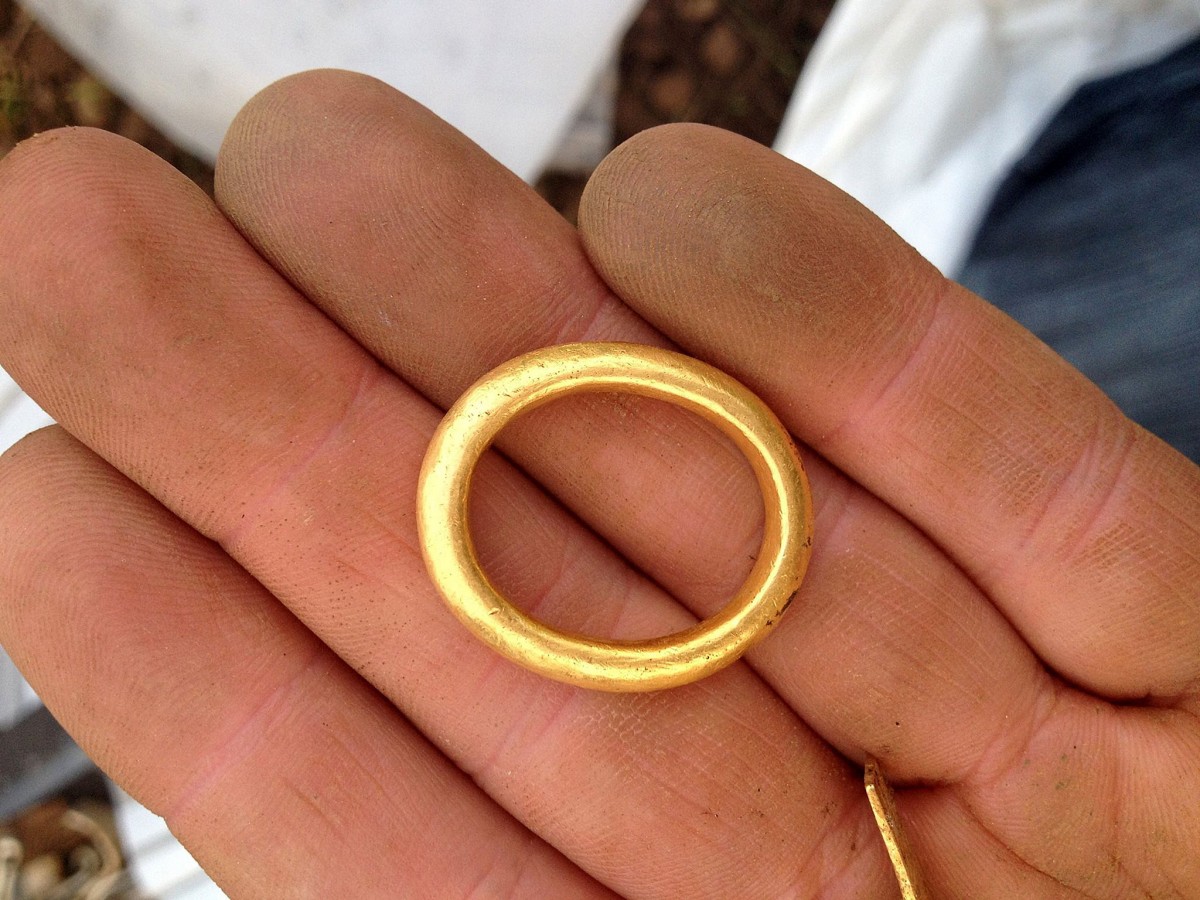 A gold ring discovered within the hoard. It's oval shape suggesting it had been worn. (Image: Derek McLennan)