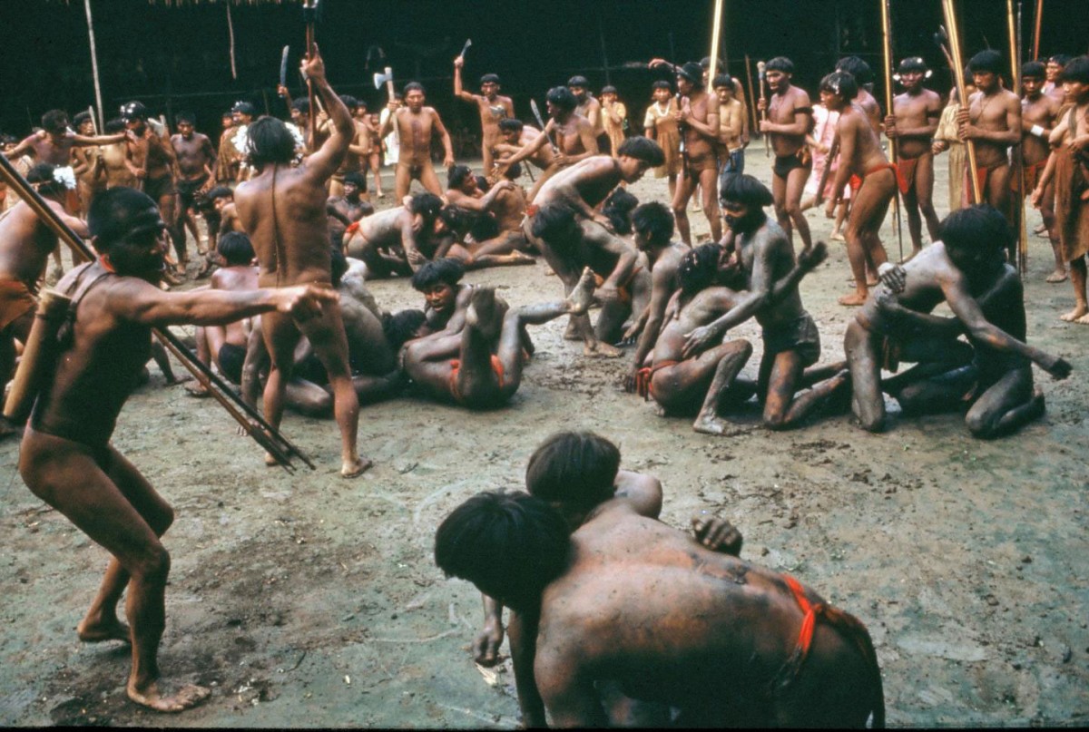 In this mid-1960s photo, men from two Yanomamo villages in the Amazon engage in nonhostile combat to determine the strength and fighting prowess of potential alliance partners. Credit: Napoleon Chagnon