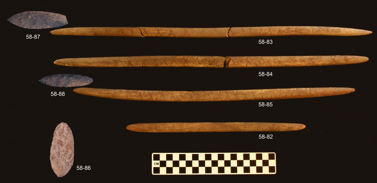 Burial offerings. Stone decorated points and associated antler foreshafts. UAF, photo courtesy of Ben Potter.