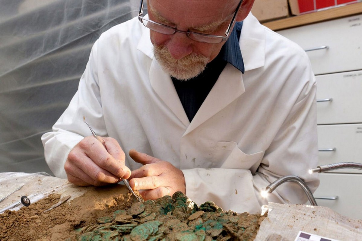 Conservation expert Neil Mahrer working on Le Cantillon II. Photo Credit: Jersey Heritage.