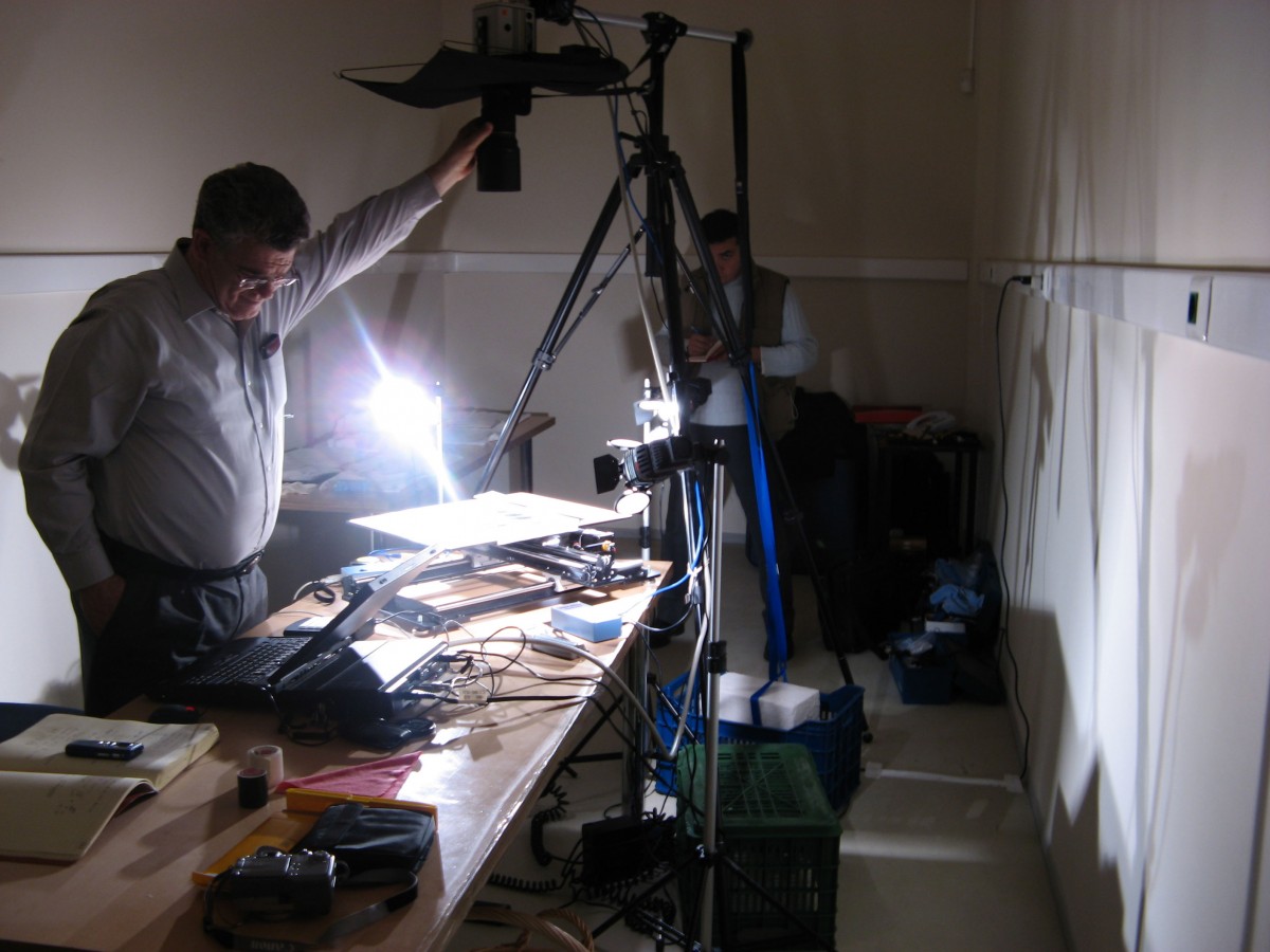 Examining the Derveni Papyrus with the Brigham Young Universsity Digital Imaging Team. © Institute for Philosophical Research.