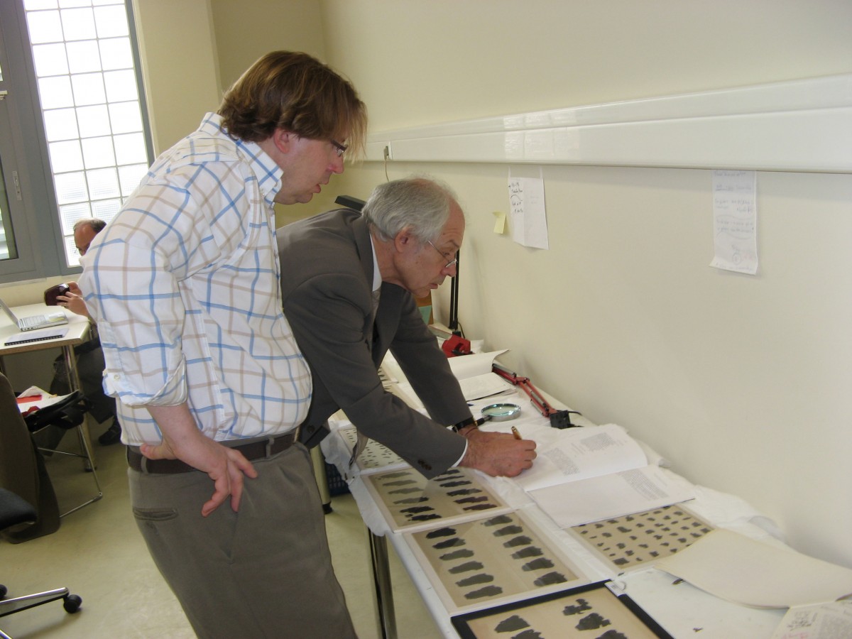 Examining the Papyrus. © Institute for Philosophical REsearch.