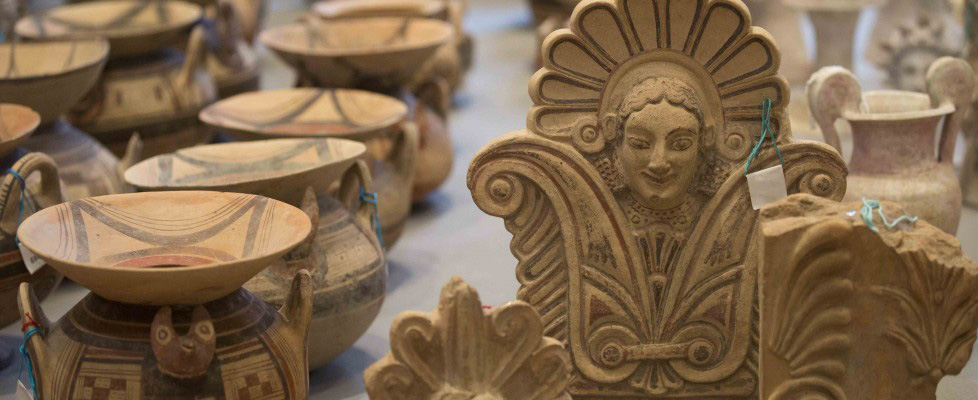 The looted antiquities were laid out at the Terme di Diocleziano museum during a press conference held on Wednesday, January 21, 2015, in Rome. Credit: Repubblica