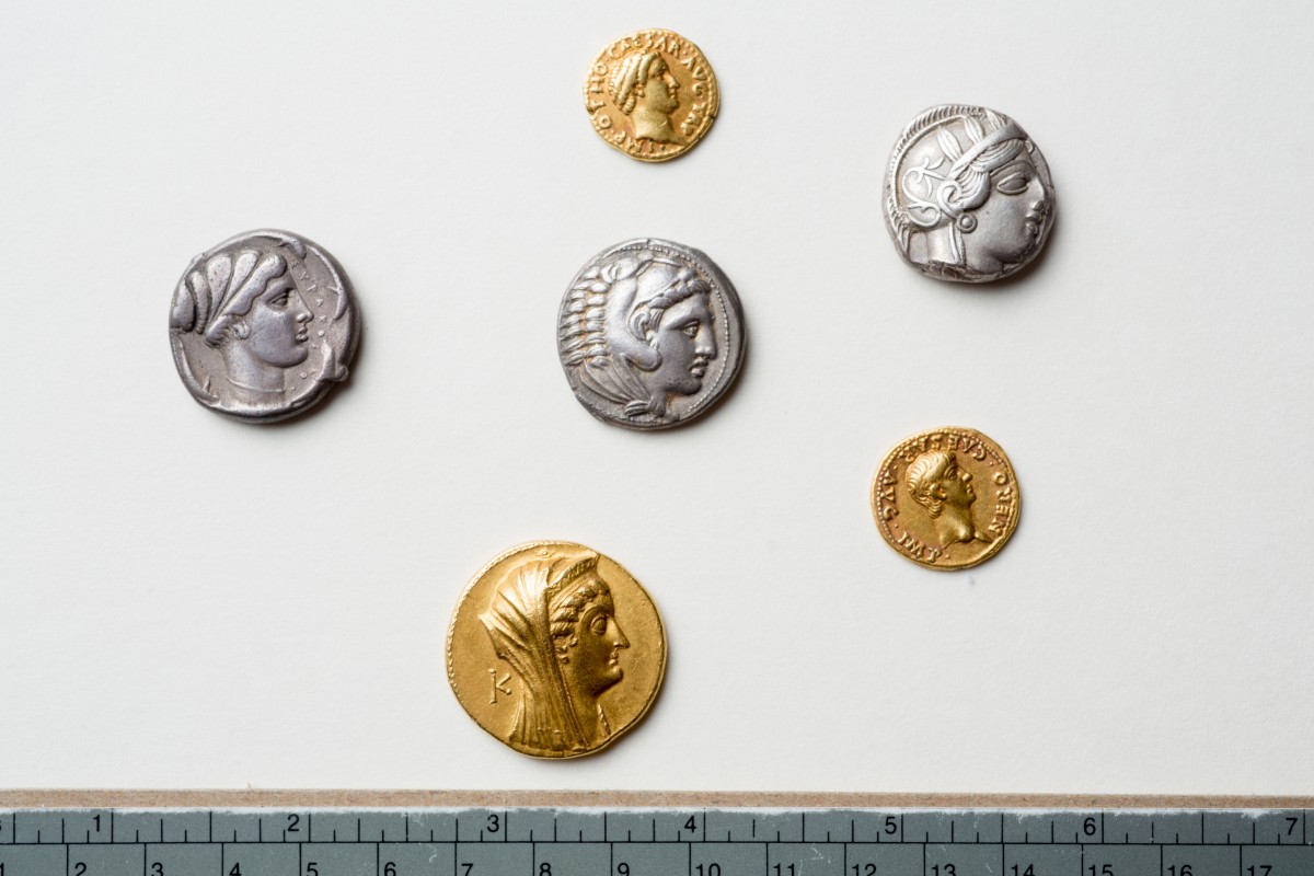 Gold and silver coins from the collection discovered at the University of Buffalo Libraries. Photo Credit: Douglas Levere.