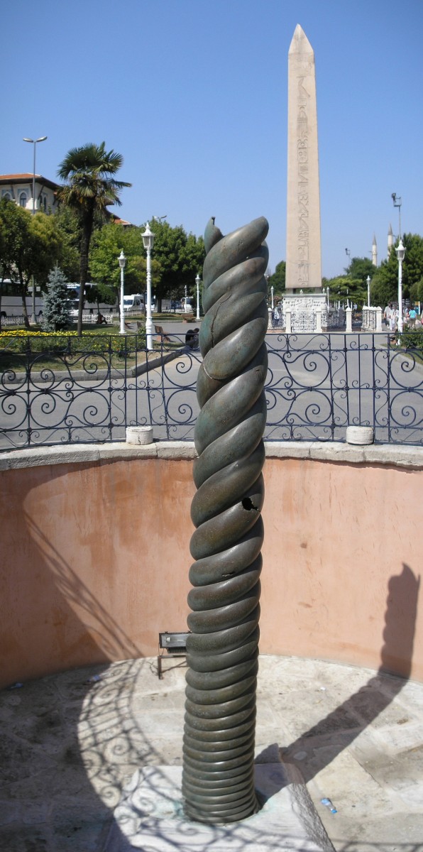 The Serpent Column in Constantinople. The Obelisk of Theodosius is seen in the background.