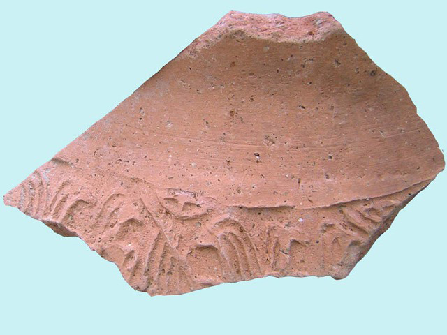 Fragment of cylinder seal impression found at Bet Ha-'Emeq site.
Copyright: Nimrod Getzov, courtesy Israel Antiquities Authority
