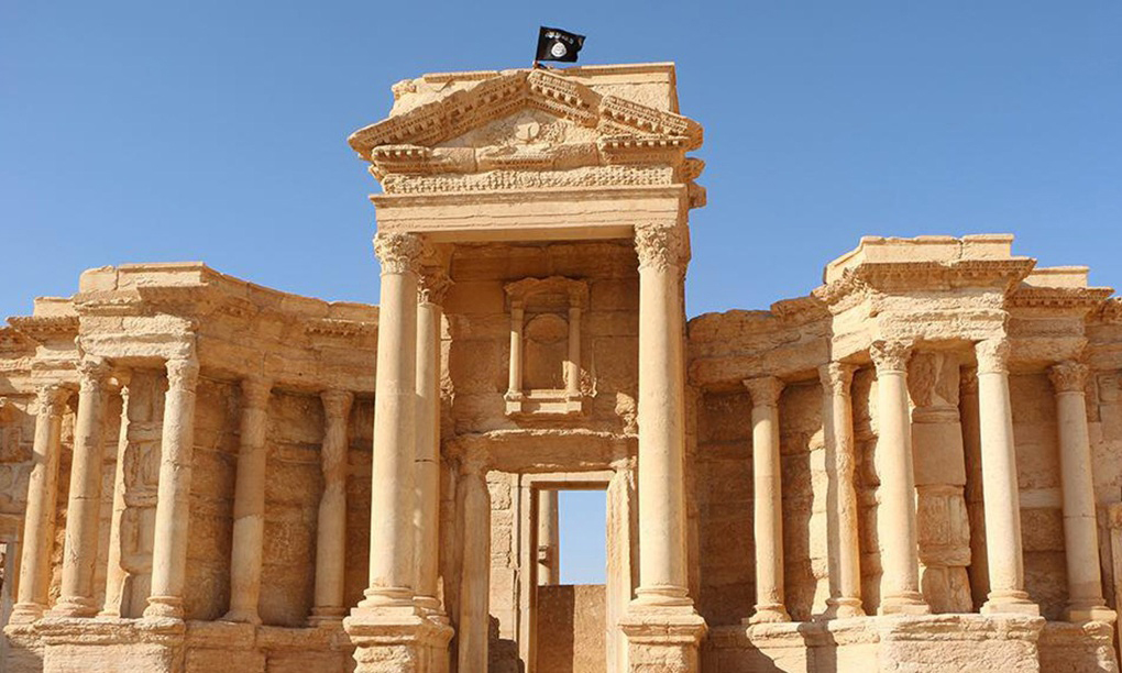 An Islamic State flag flies atop Roman ruins at the ancient city of Palmyra. Photograph: AFP/Getty Images.