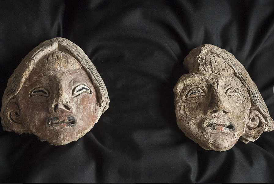 The two female clay heads found at the same site.