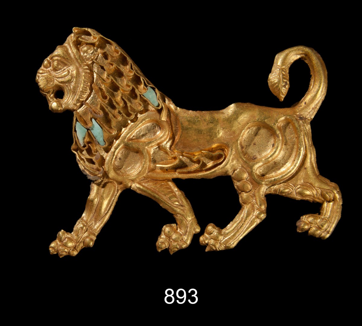 Gold sheet in the shape of a lion, initially sewn onto a textile. Probably a spoil from Persia dedicated to the Great Gods by a soldier of Alexander the Great after his return from the expedition. 4th cent. BC. Credit: Acropolis Museum.
