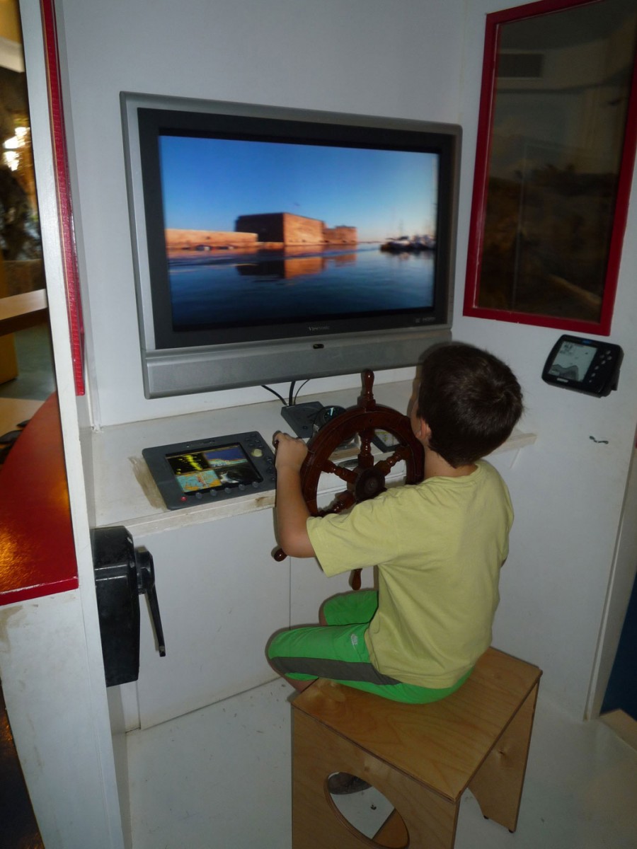 Fig. 6. Natural History Museum of Crete, children’s wing “Discovery Centre”. On the boat children play the part of the captain and learn about life at sea (Photographic archive of D. Kalessopoulou).