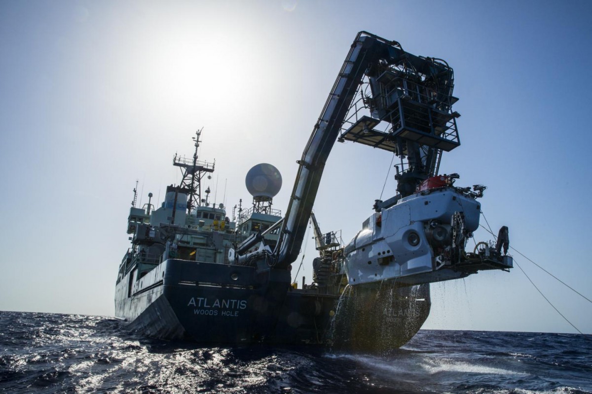 The research vessel Atlantis with the submersible Alvin hanging off its sterm. (credit: Luis Lamar, Woods Hood Oceanographic Institution).