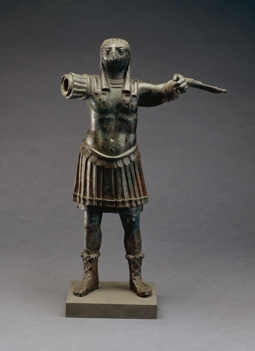 Bronze figure of the ancient Egyptian falcon god Horus in Roman armour (EA 36062).  ©The Trustees of the British Museum. 