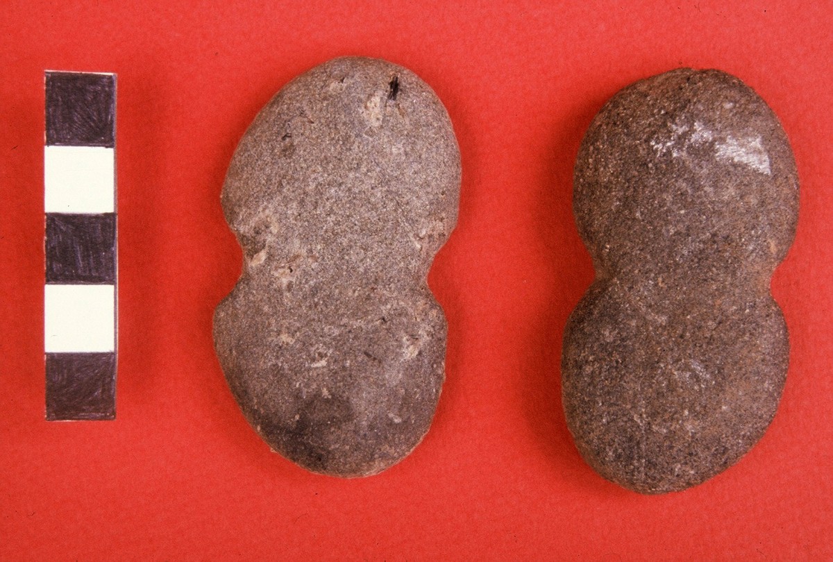 Fig. 27. Eight-shaped stone weights, probably for weaving or fishing.