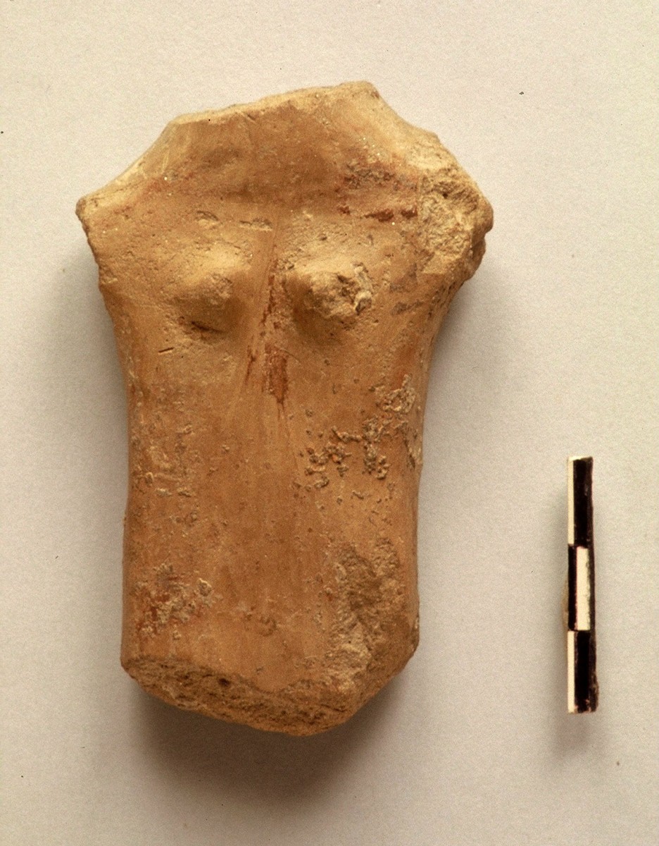 Fig. 37. Plank figurine with sculpted breasts and faded written decoration. Chalcolithic period.