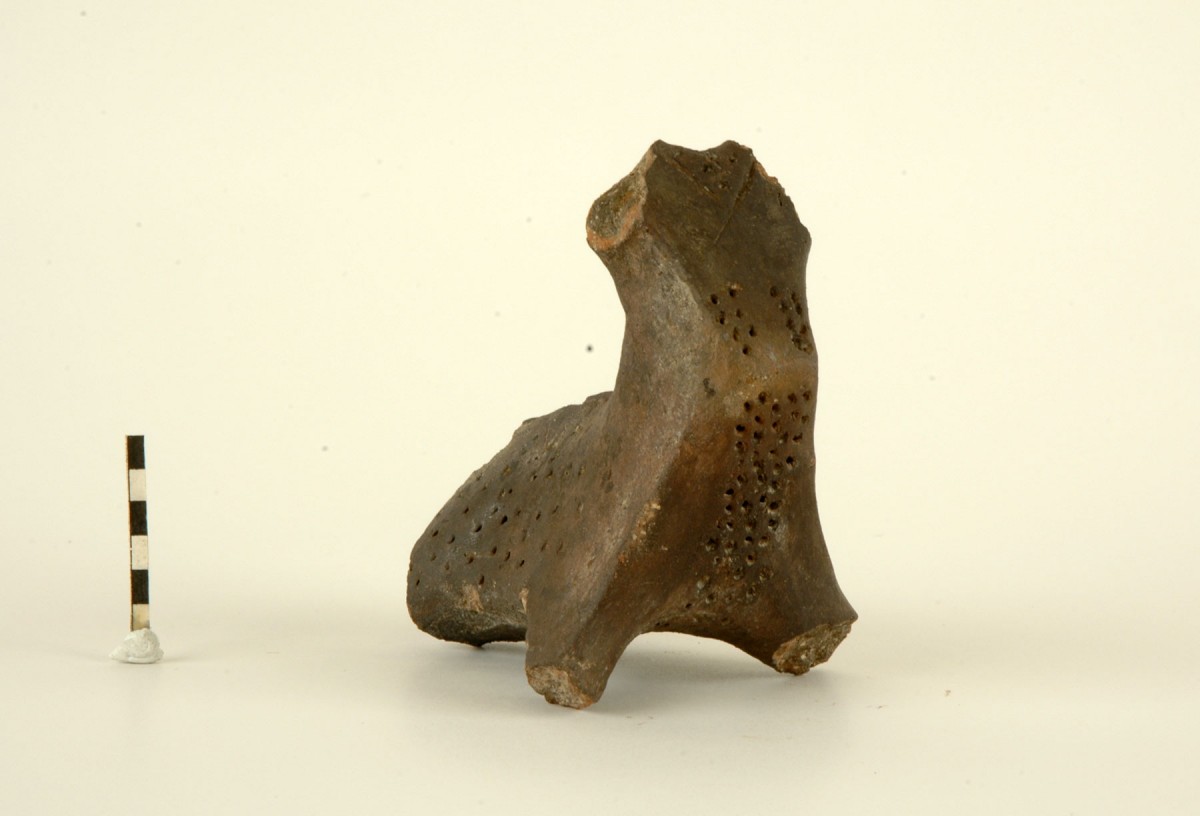 Fig. 41. Balkan type figurine, probably a combination of human with animal features (a sort of centaur perhaps?). It may have been attached as a handle to a utensil whose mouth took the place of the head. It has dotted decoration, probably recreating the animal’s fur. Chalcolithic period.