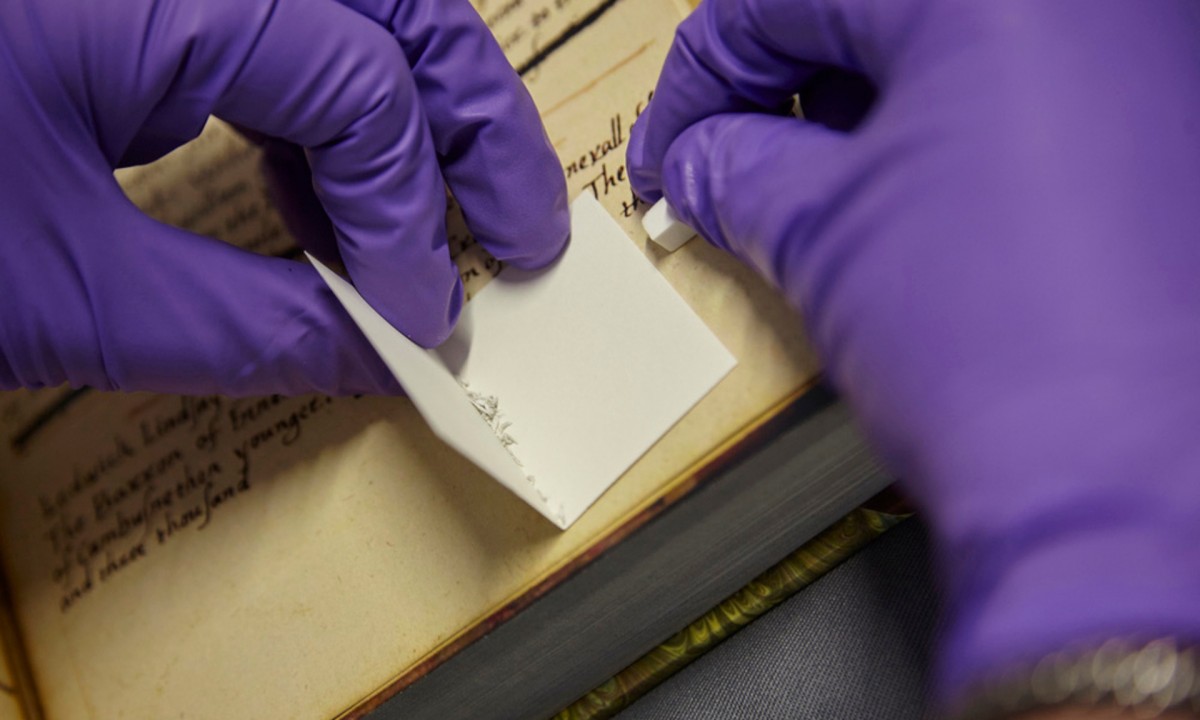 Non-invasive sampling extracting protein from parchment using eraser crumbs. Photograph: Reproduced by courtesy of The John Rylands Library University of Manchester.