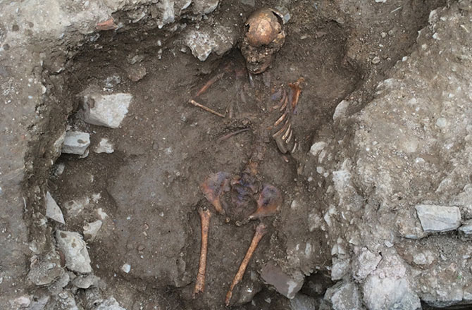 The Medieval skeleton of a teenage girl, burnt and hastily buried in a pit was found in Northern Italy. Photo Credit: Discovery News.