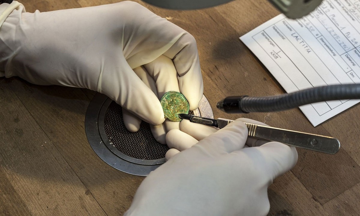 Archaeologists say the coins are dated back to a period stretching from the reign of Aurelian to the rule of Maximian. Photo Credit: AFP/Kantonsarchaeologie Aargau .