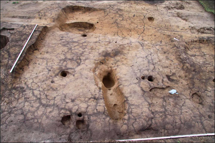 Fish was processed by putting it in pits in the red-coloured ground to give it a 'special smell'. Photo Credit: Institute of Archeology and Ethnography SB RAS.