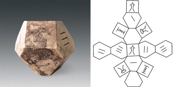 The dice, made of animal tooth, has 14 faces. Two of the faces are blank while the others contain the numbers 1 through 6, with each number shown twice on the dice. Image Credit: courtesy Chinese Cultural Relics/Live Science.