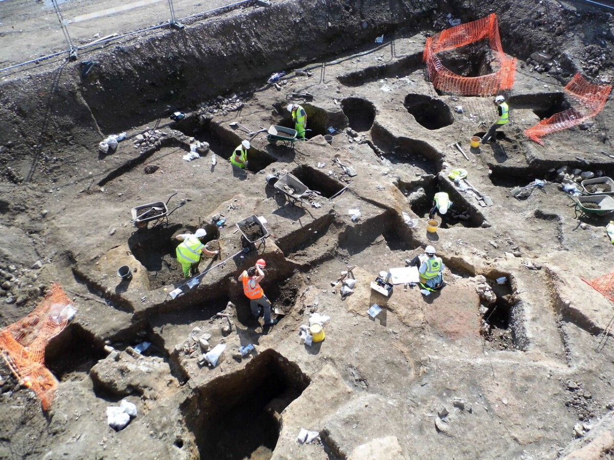 Archaeologists excavate large areas of medieval and post-medieval  pitting in the backyards of properties running along Southgates  [Credit: University of Leicester]