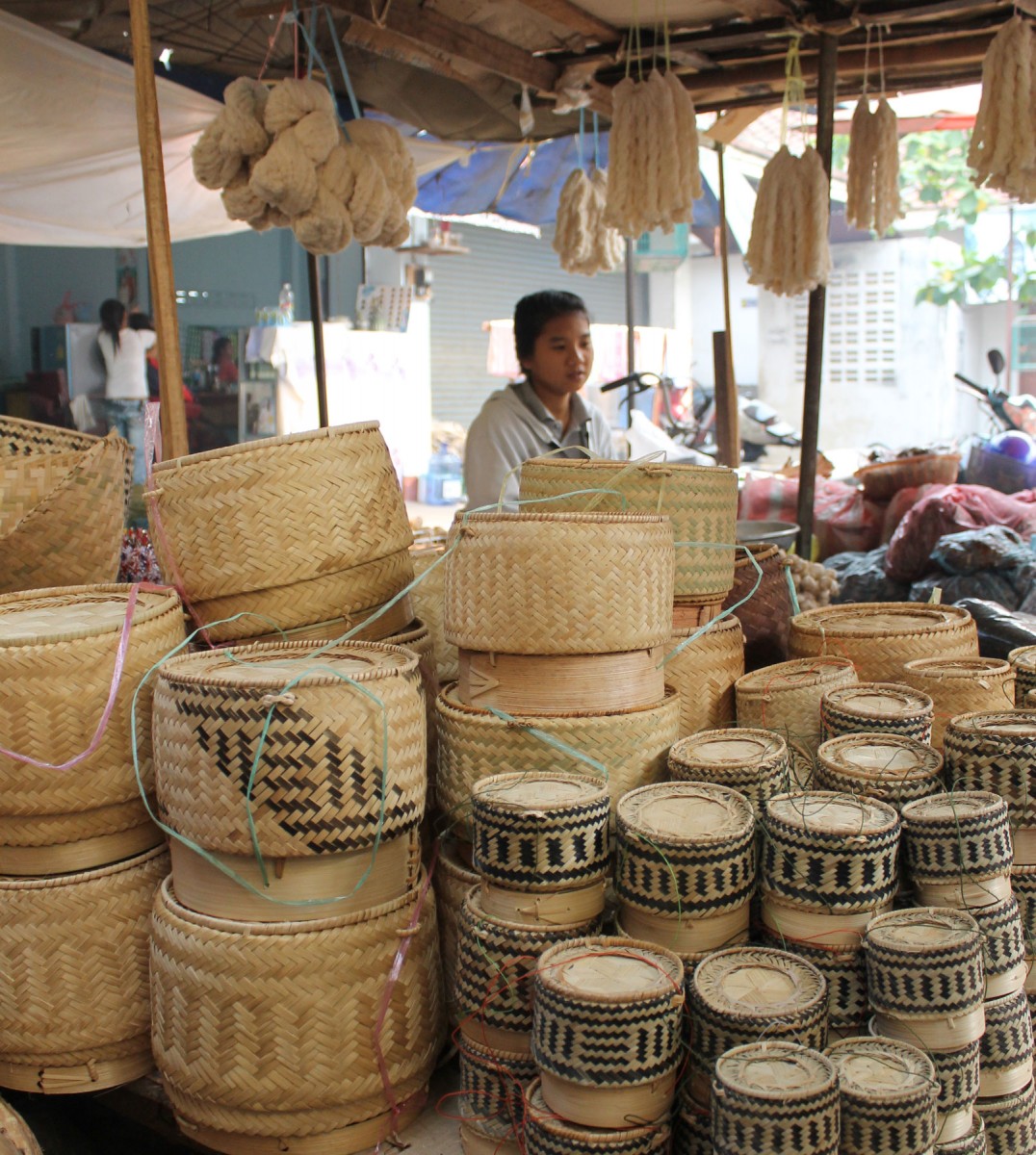 Various sizes of rice serving baskets for sale at Phousi Market in Luang Prabang, Laos.
