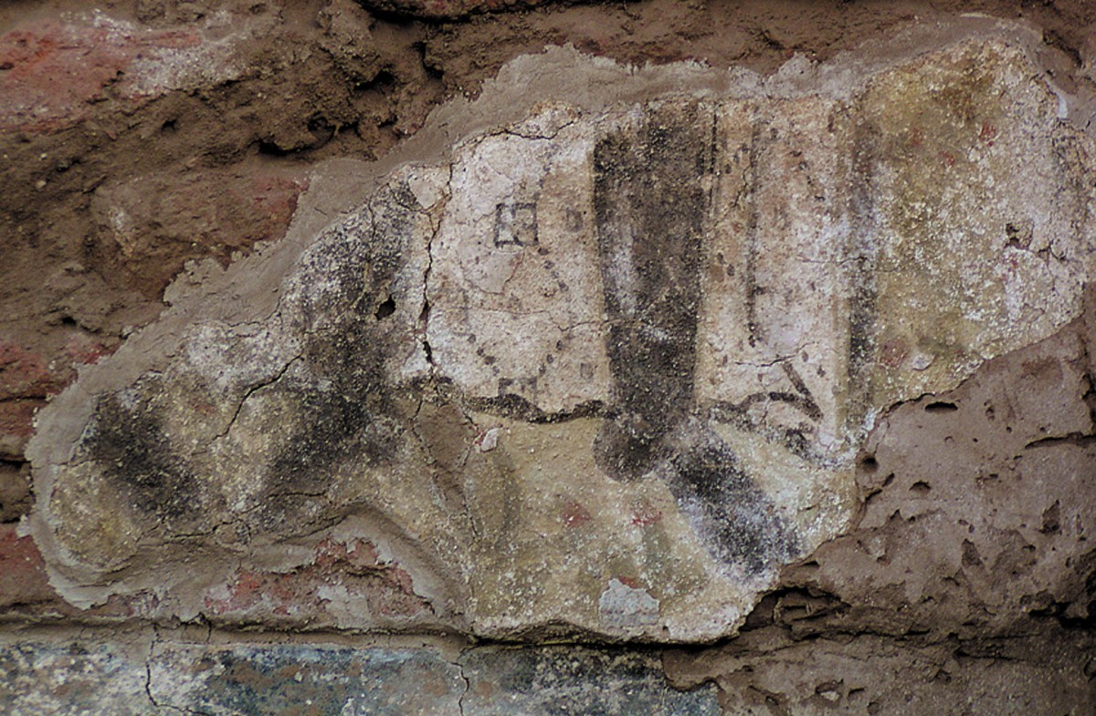 Fig. 1. Old Dongola, Cruciform Building; fragment of wall painting with warriors’ legs on the north wall in the eastern arm of the building (phot. W. Godlewski) (Zielińska 2010a, fig. 5).