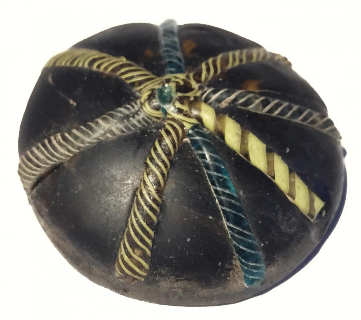 A glass counter decorated with twisted colorful strands was found at the site.
Credit: University of Sheffield