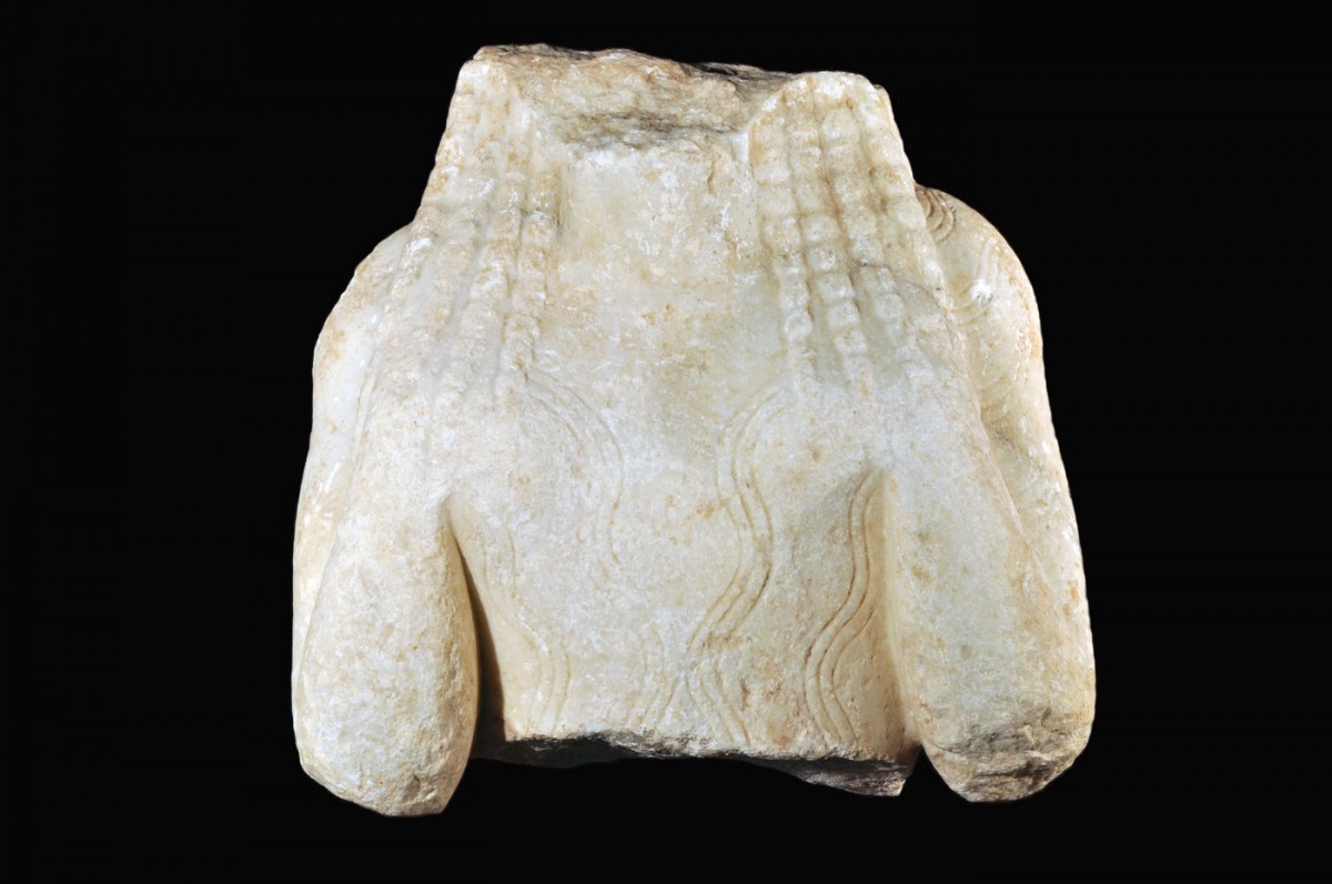 Fig. 15. Marble torso of a praying Kore with hands on shoulders, 580-570 BC. Town of Chios (Atsiki-Ag. Ioannis).