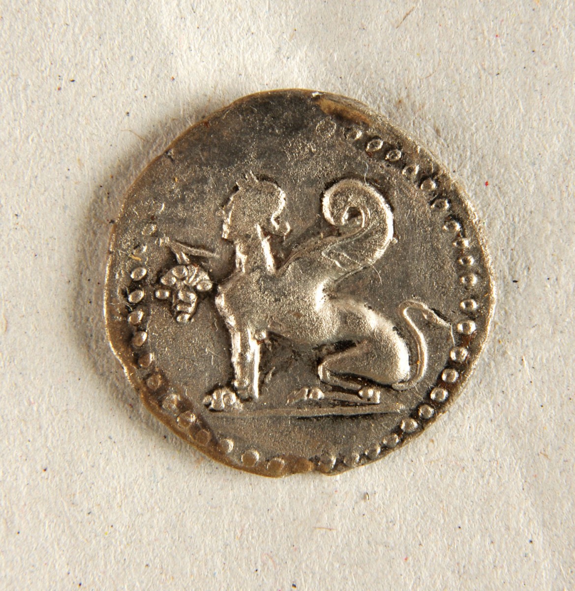 Fig. 22. Silver Chian coin depicting a Sphinx holding a bunch of grapes. 190-184 BC.