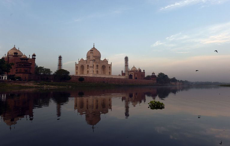 The Taj Mahal, shown in April, sits by the Yamuna River in Agra, India. The effects of pollution on India’s cultural heritage sites, though less obvious than their impact on health, are worthy of attention, experts say. PHoto Credit Prakash Singh/Agence France-Presse/Getty Images/NY Times.