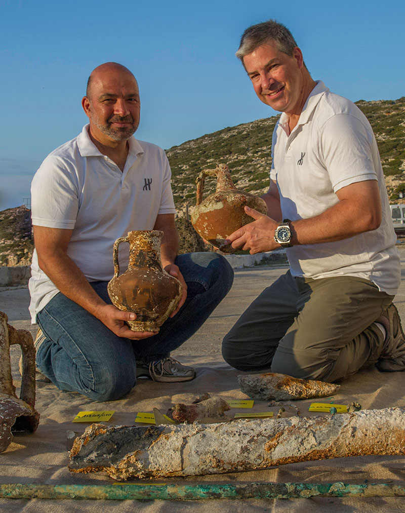 Project co-Directors Theotokis Theodoulou and Brendan Foley compare ceramic containers recovered from the Antikythera Shipwreck. (Photo by Brett Seymour, EUA/WHOI/ARGO) 