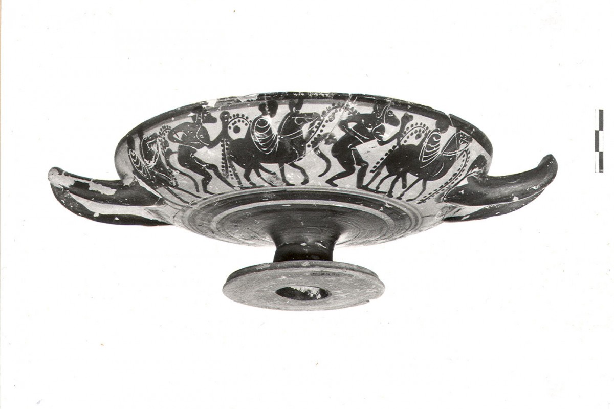 Fig. 4b. Example of imported grave offerings from Attica (1st quarter of 5th c. BC). Black-figure kylix K.3555 with a scene from the Dionysian cycle. Depicted in the centre is a satyr with an ass’ head holding a horn, from Jar LXI. (Photographic archive of the 14th Ephorate of Prehistoric and Classical Antiquities)