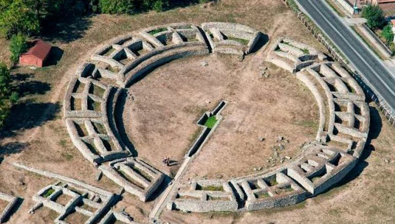 Ruins of the Roman Amphitheater at Ulpia Traiana Sarmizegetusa. Photo Credit: Realm of History.