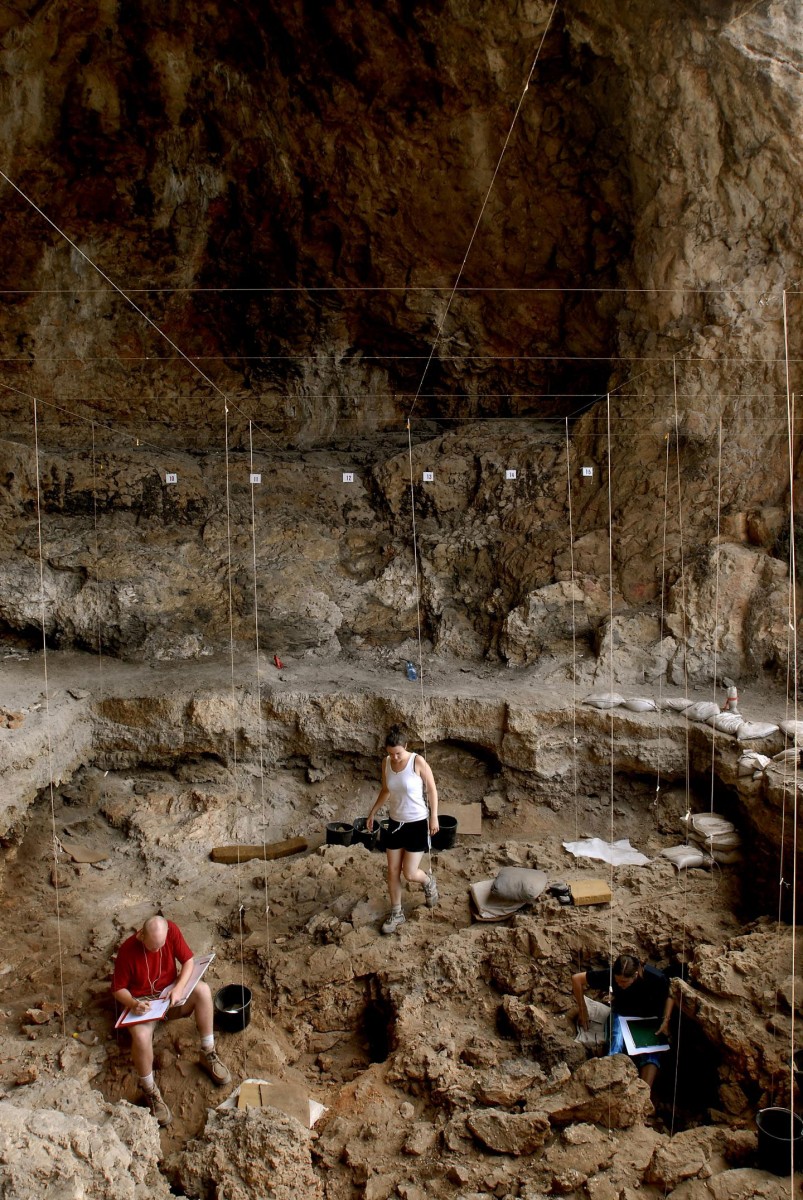 Hebrew University archaeologists uncover 12,000 year old grave inside a cave in northern Israel. Credit: Naftali Hilger.