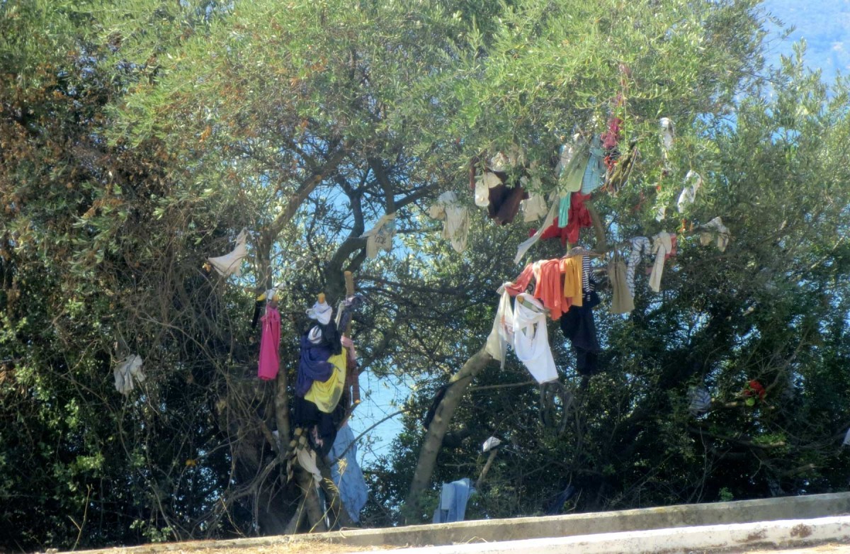 People often hang clothes, handkerchiefs or threads as votive offerings from branches of trees that are close to some church.