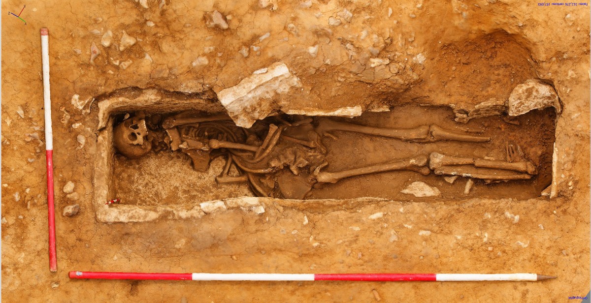 The man's feet were folded underneath his legs on account of the sarcophagus being too short for the body.